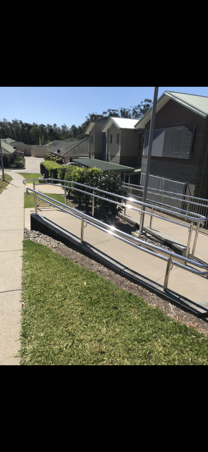 A ramp leading to a building with a flag on it — Fabricator In Coffs Harbour, NSW