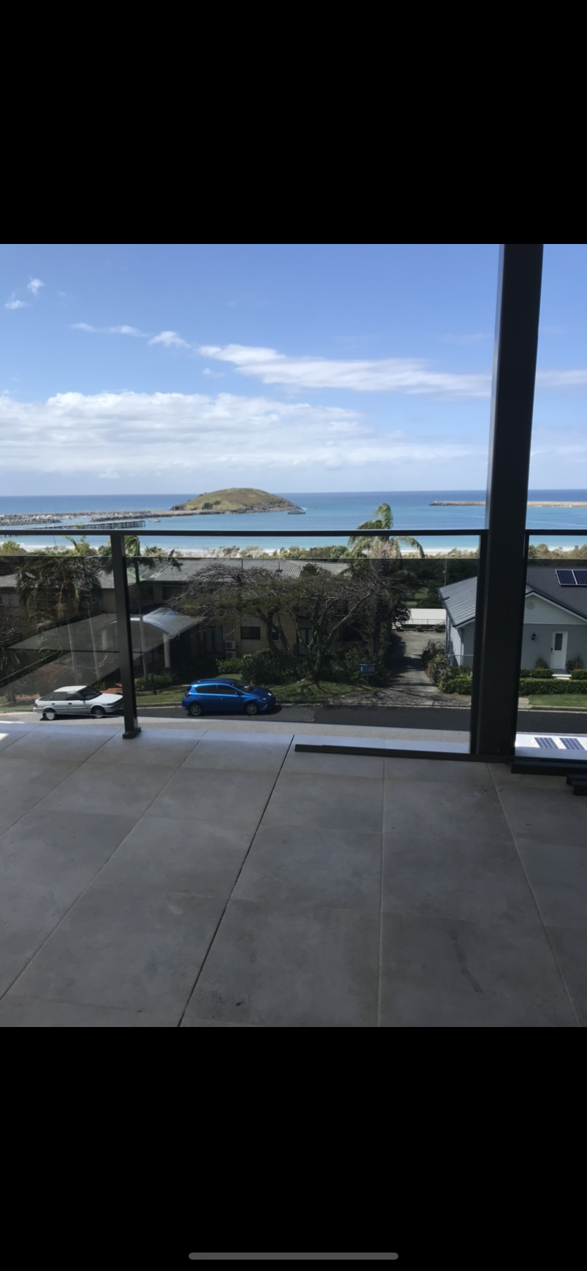 There is a balcony with a view of the ocean — Fabricator In Coffs Harbour, NSW