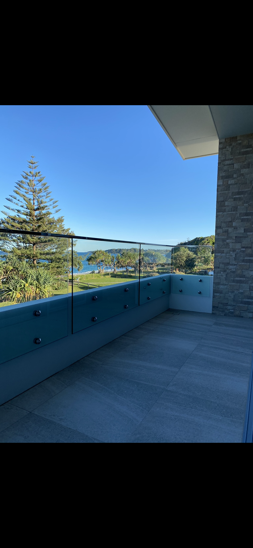 There is a balcony with a view of the ocean — Fabricator In Coffs Harbour, NSW