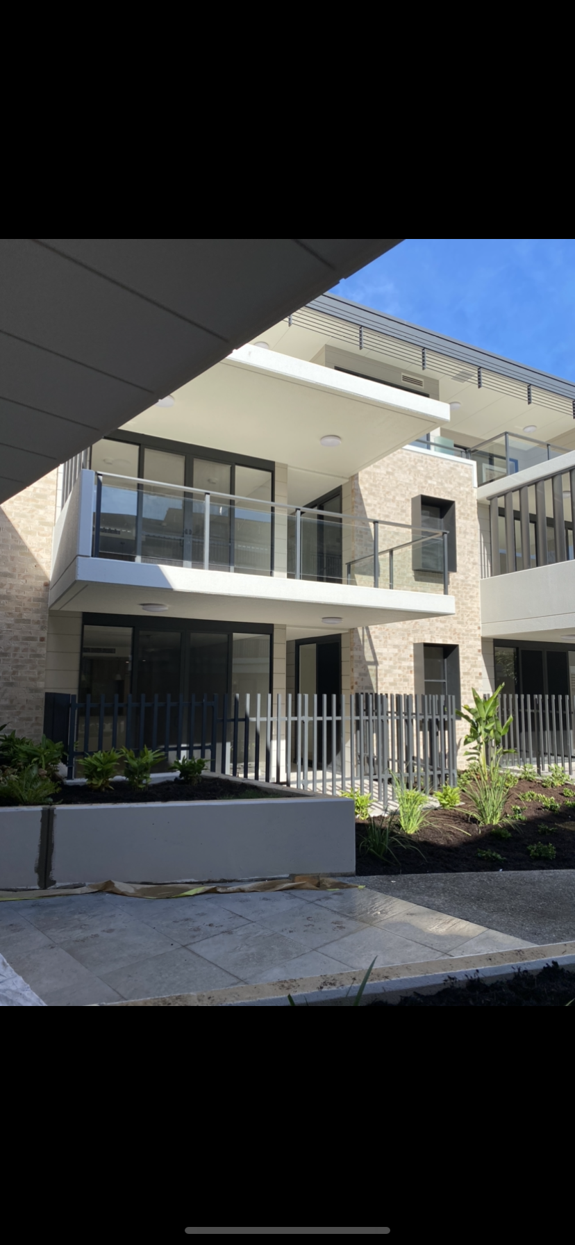 A large building with a lot of windows and balconies — Fabricator In Coffs Harbour, NSW