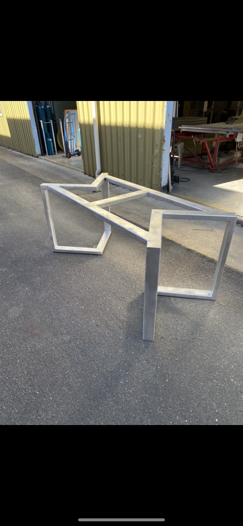 A metal table frame is sitting on the side of the road — Fabricator In Coffs Harbour, NSW