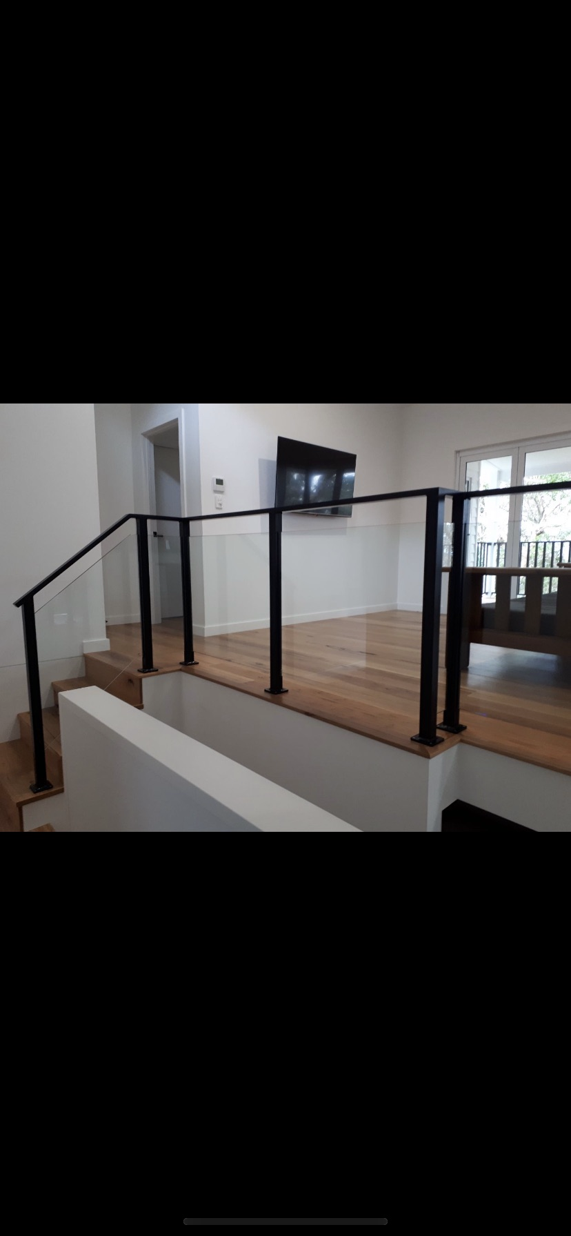 A picture of a staircase with a glass railing in a house — Fabricator In Coffs Harbour, NSW