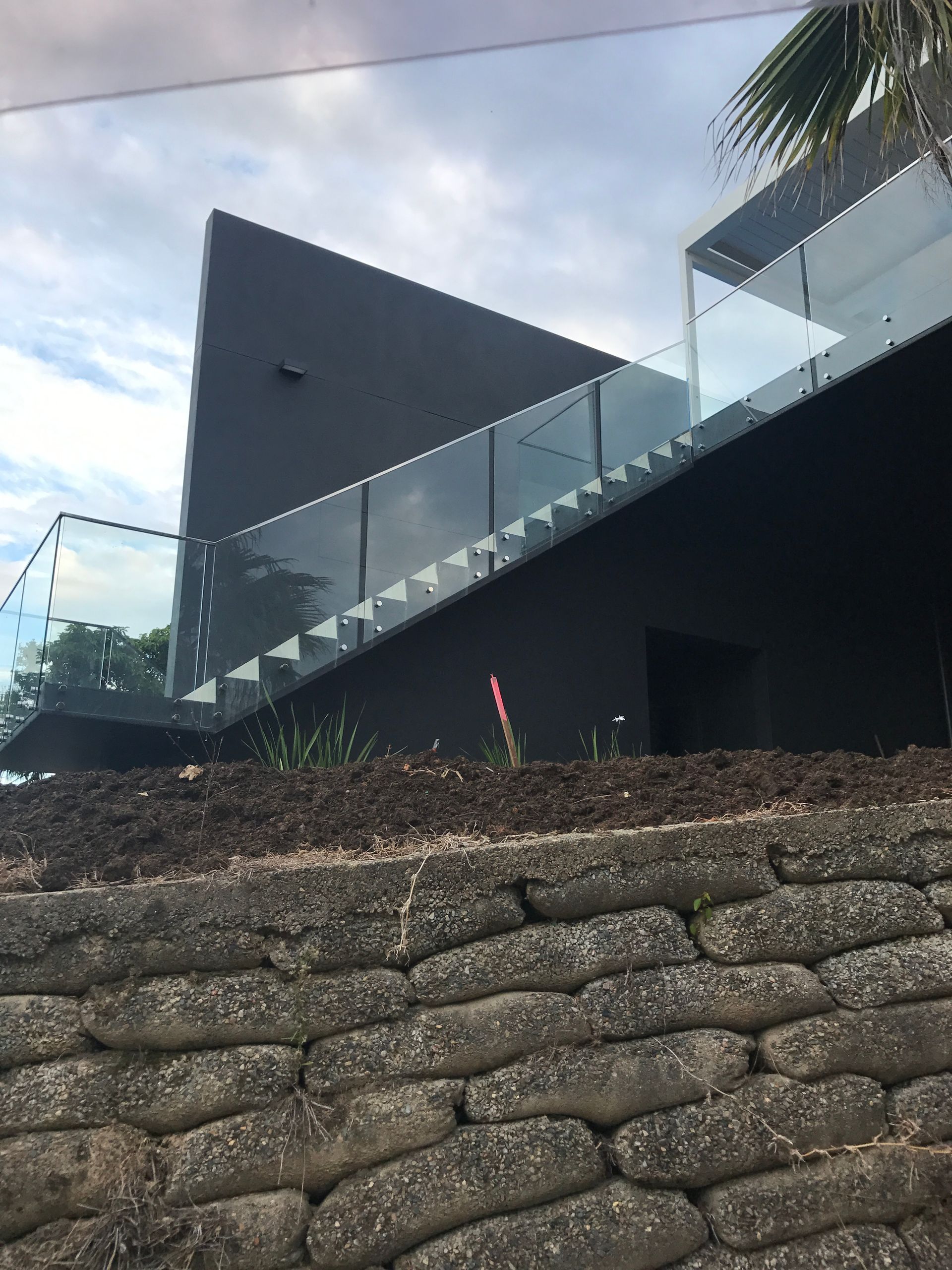A black building with stairs and a glass railing — Fabricator In Coffs Harbour, NSW