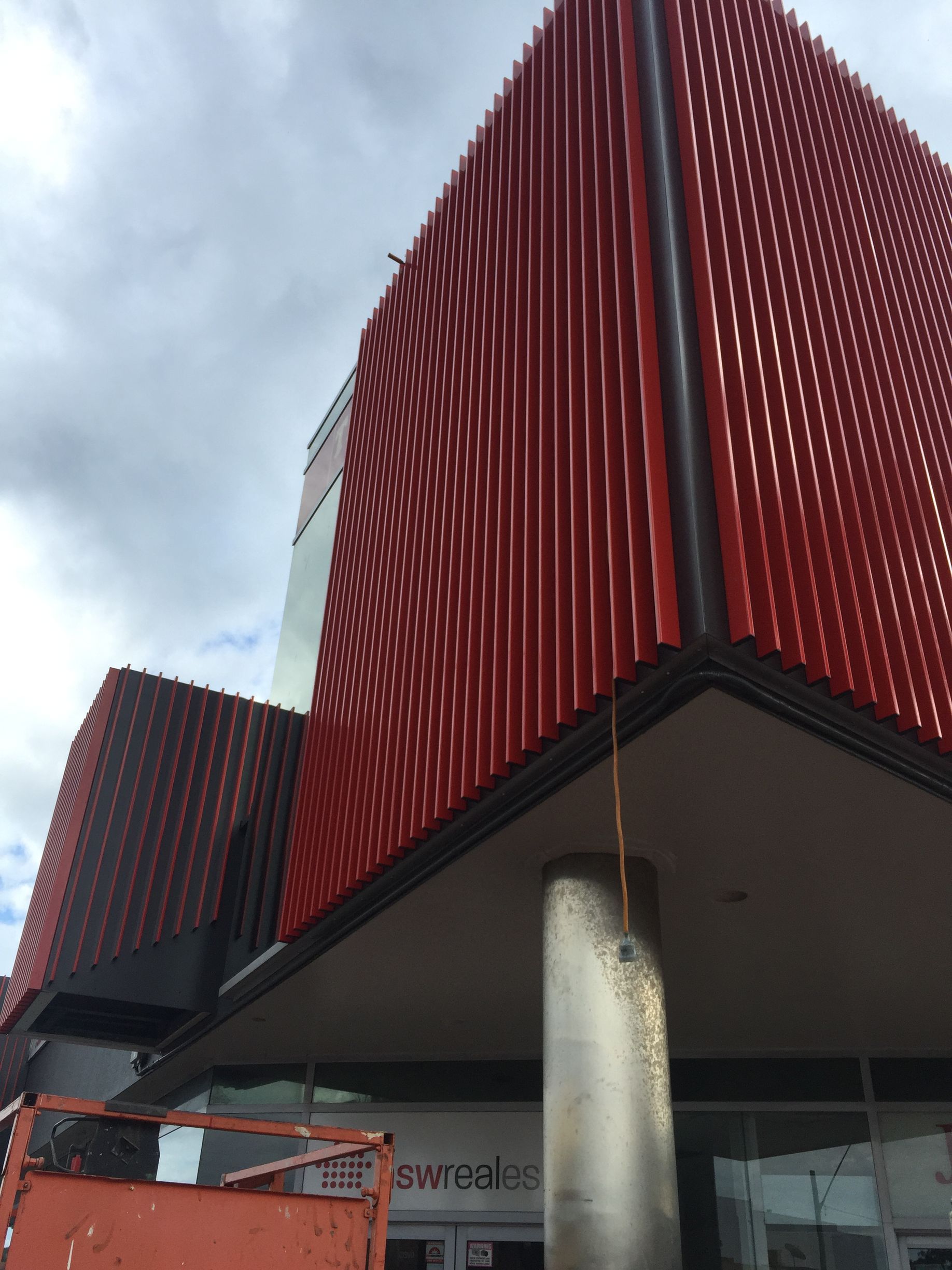 A large red building with a crane in front of it — Fabricator In Coffs Harbour, NSW