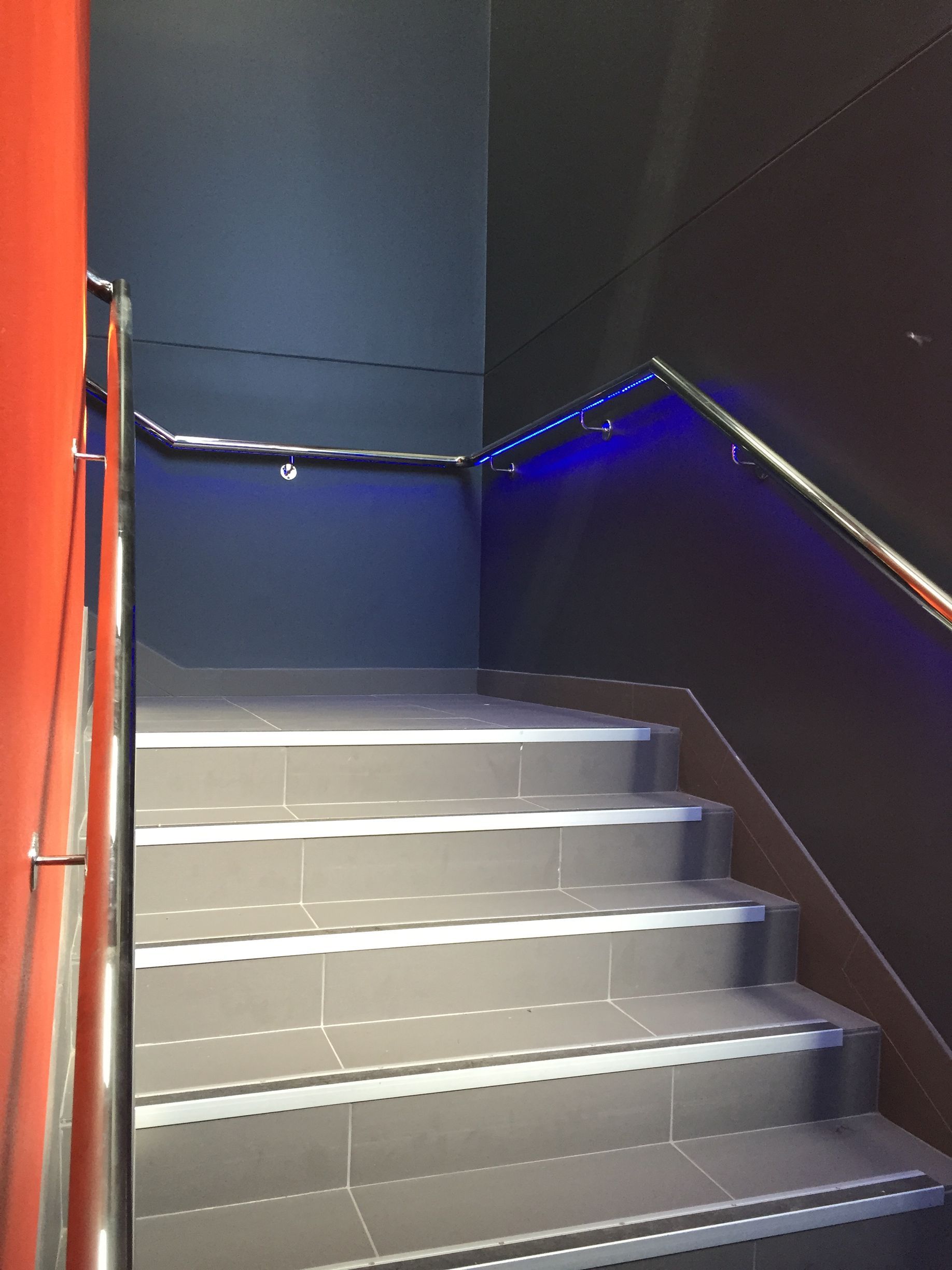 A set of stairs with a blue light on the railing — Fabricator In Coffs Harbour, NSW