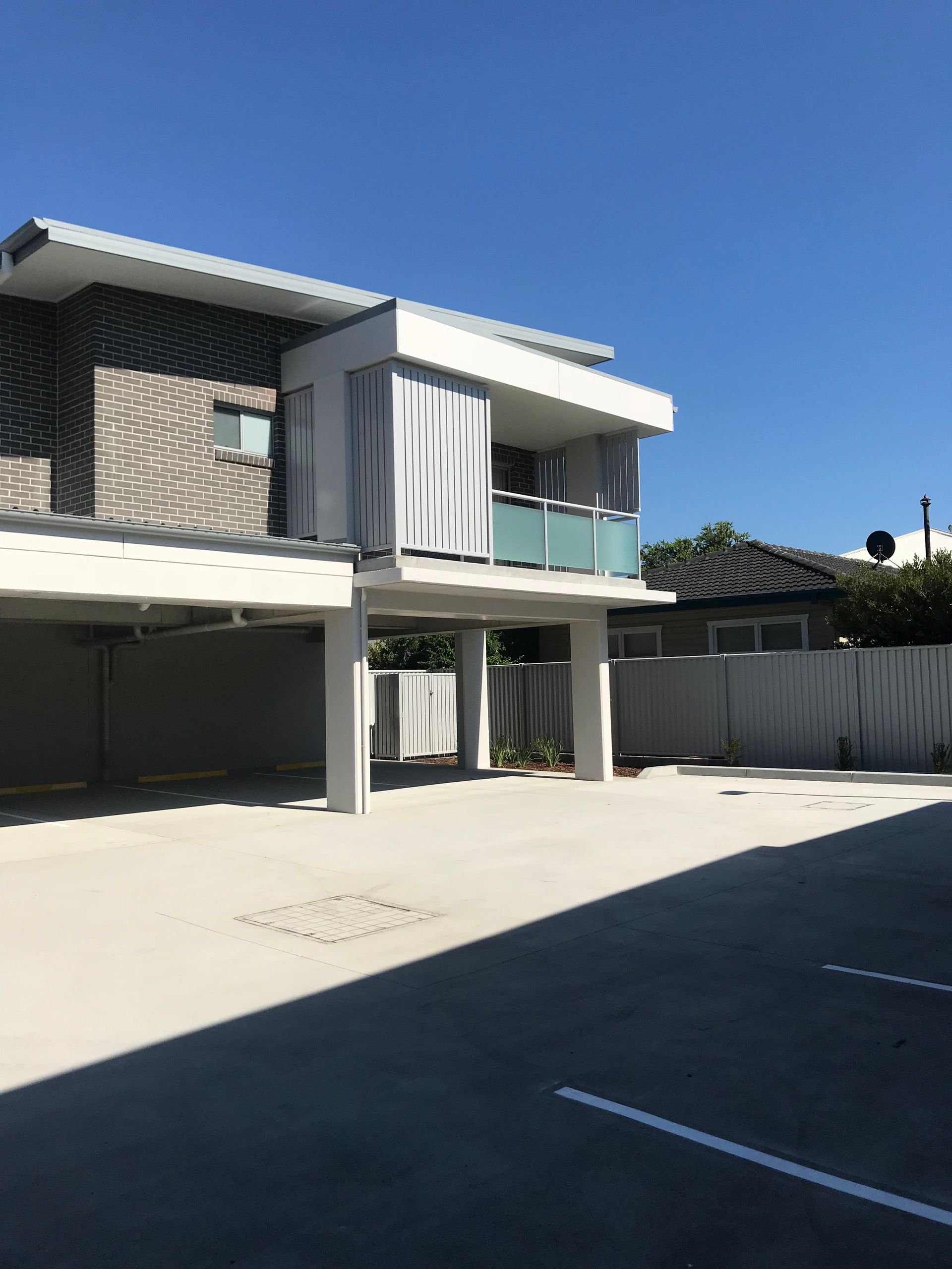 A large house with a parking lot in front of it — Fabricator In Coffs Harbour, NSW