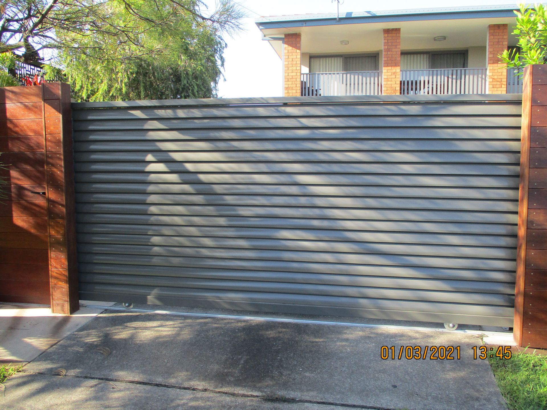 A house with a sliding gate in front of it — Fabricator In Coffs Harbour, NSW