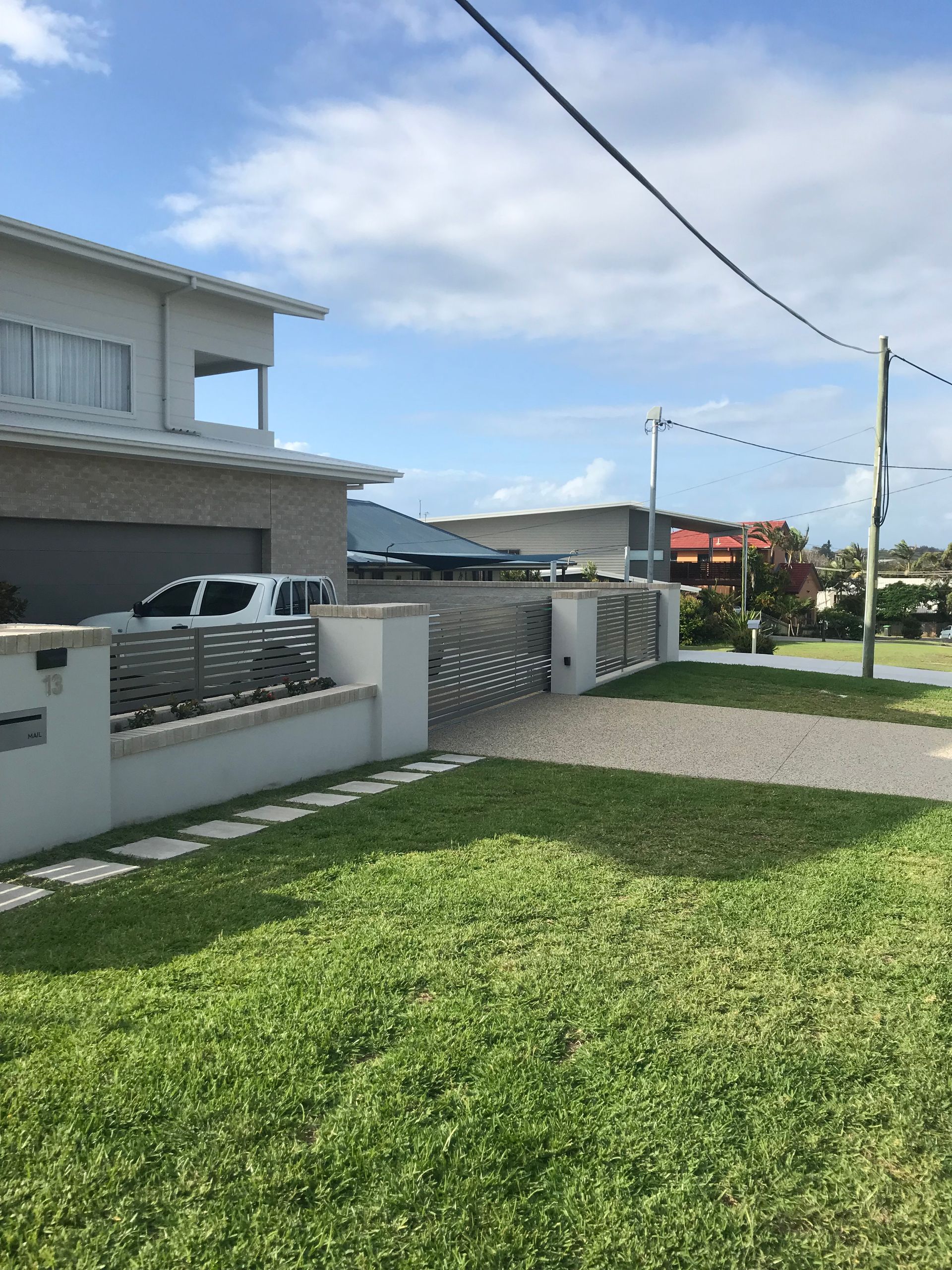 A house with a car parked in front of it — Fabricator In Coffs Harbour, NSW