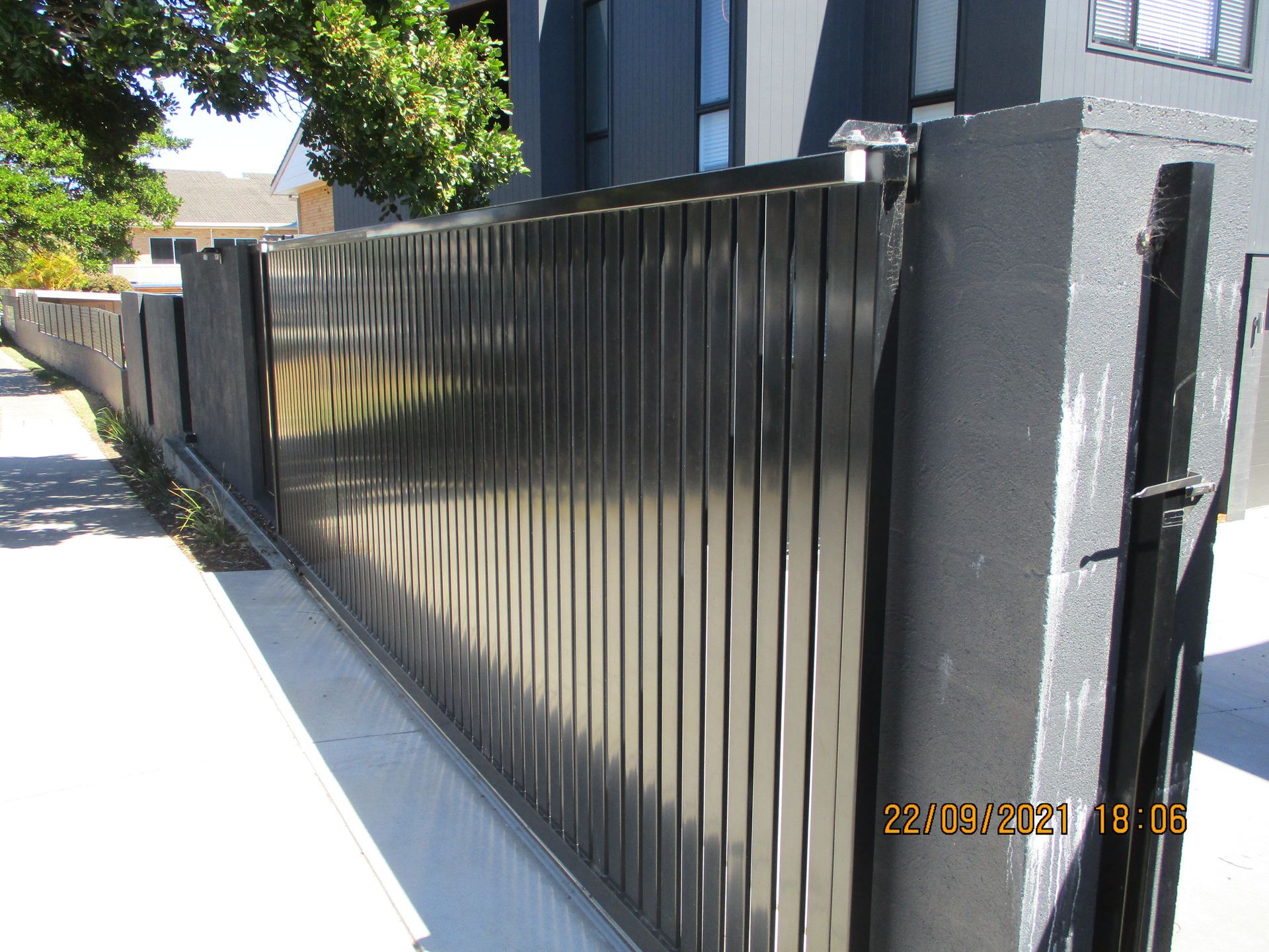 A black fence is along the side of a road — Fabricator In Coffs Harbour, NSW