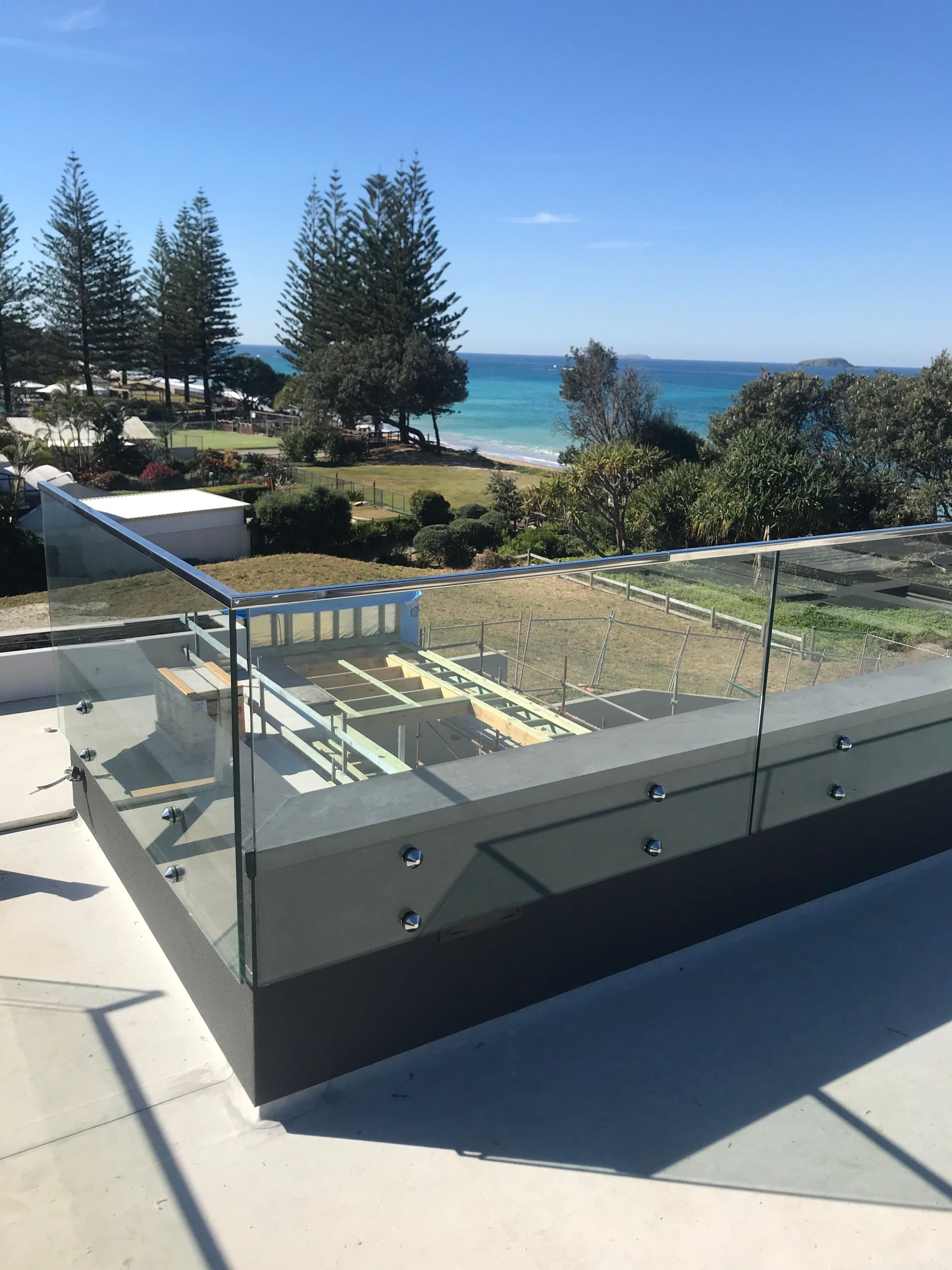 A balcony with a view of the ocean and trees — Fabricator In Coffs Harbour, NSW