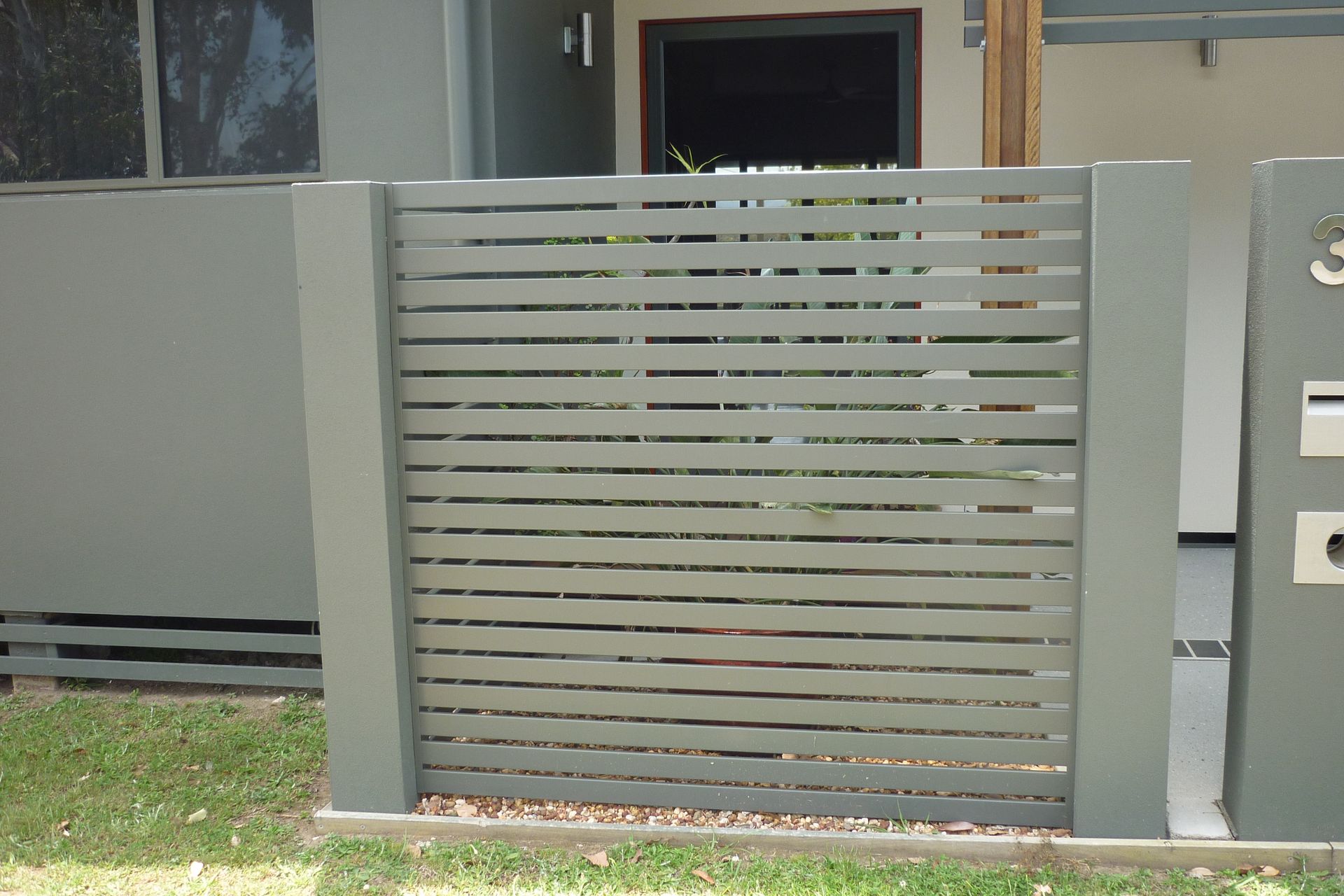 A fence with a mailbox in front of it — Fabricator In Coffs Harbour, NSW