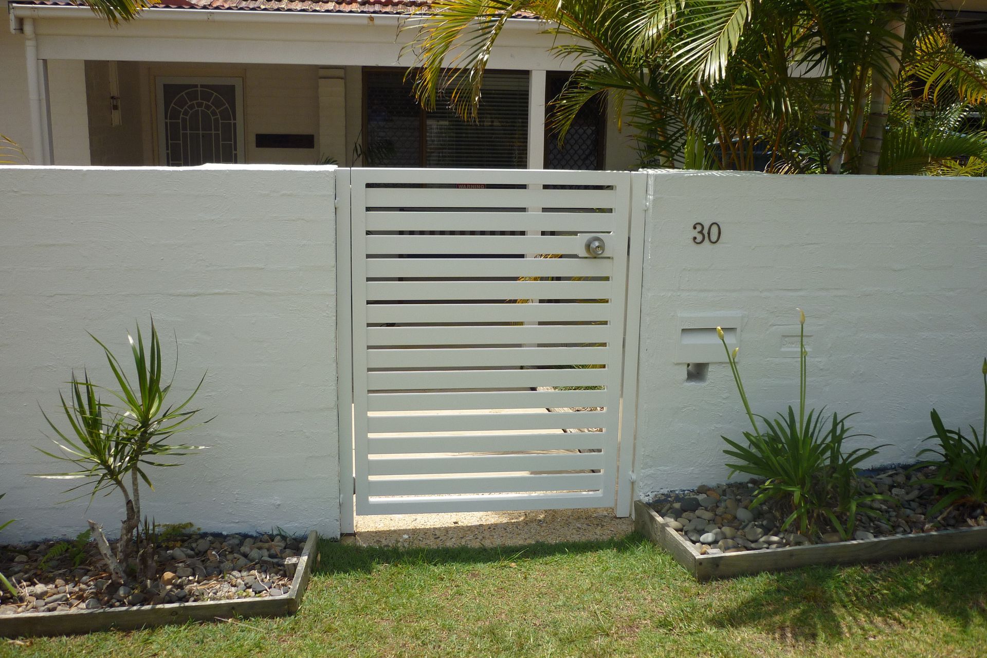 A white fence with the number 30 on it — Fabricator In Coffs Harbour, NSW
