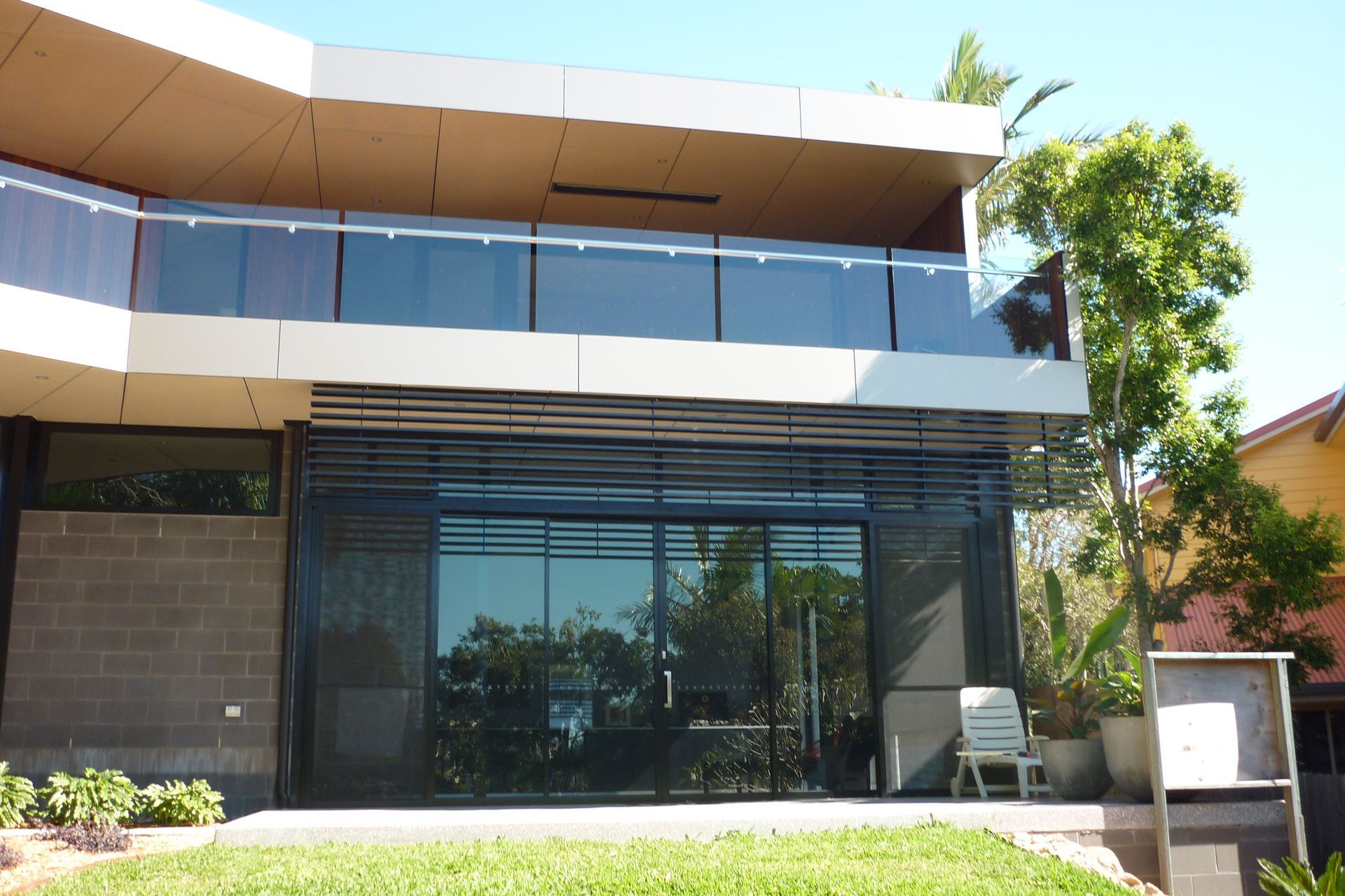 A house with a balcony and a large window — Fabricator In Coffs Harbour, NSW