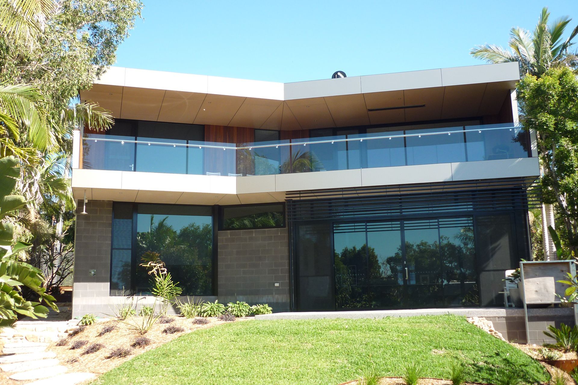 A large house with a lot of windows and a balcony — Fabricator In Coffs Harbour, NSW