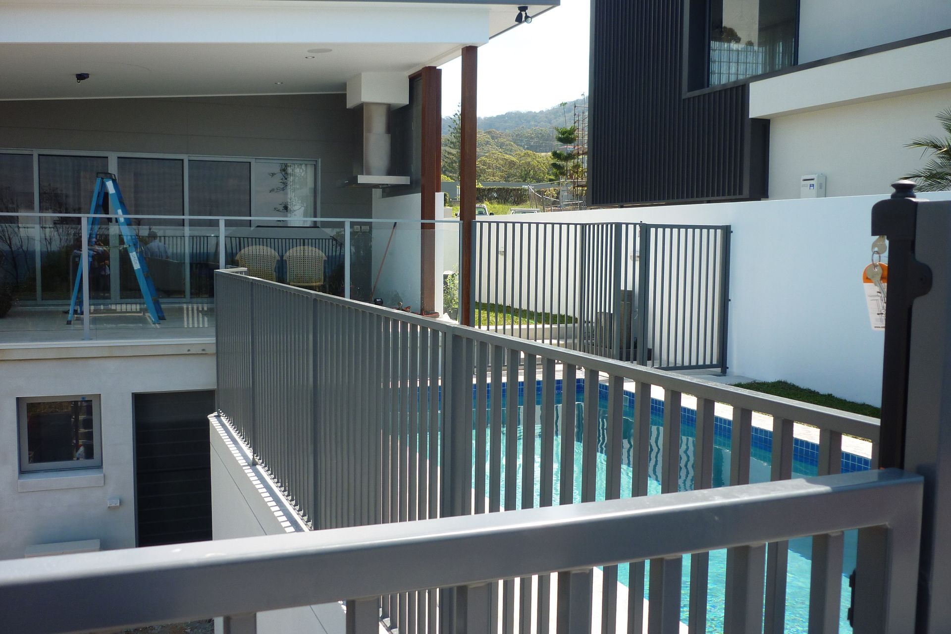 Aluminium Fence Alongside Brick Wall — Fabricator In Coffs Harbour, NSW