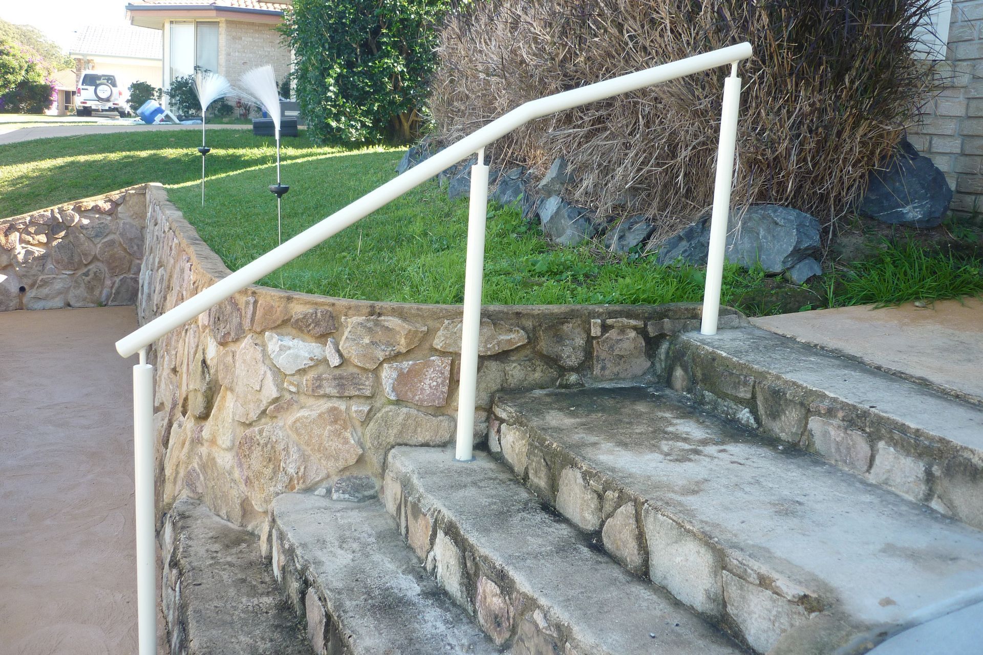 A white railing on a set of stone stairs — Fabricator In Coffs Harbour, NSW
