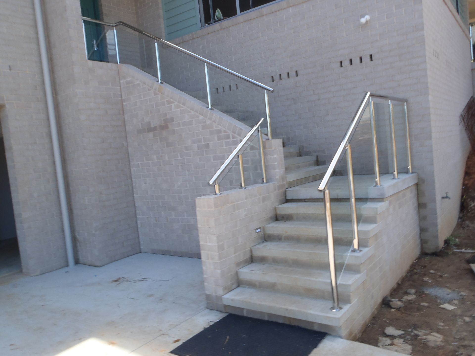 A set of stairs with a stainless steel railing — Fabricator In Coffs Harbour, NSW