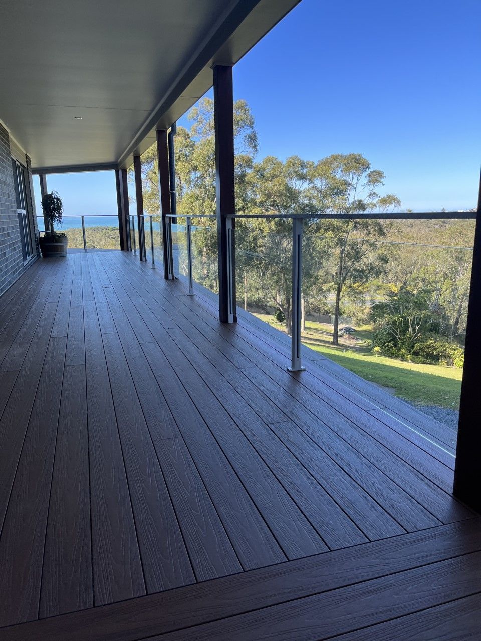A large deck with a view of the ocean and trees — Fabricator In Coffs Harbour, NSW