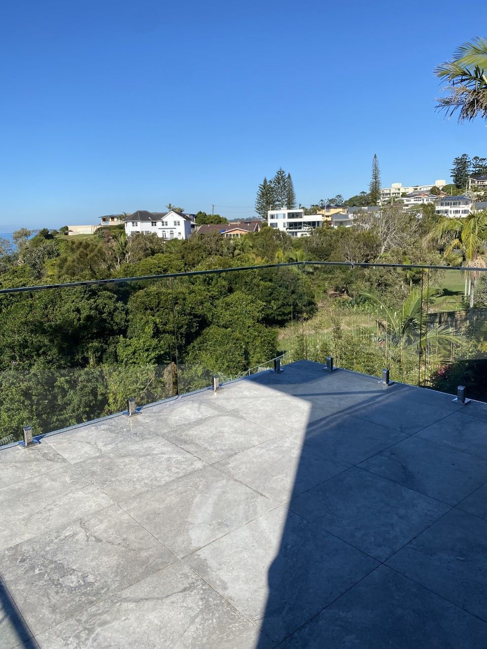 A view of a city from a balcony with trees in the background — Fabricator In Coffs Harbour, NSW