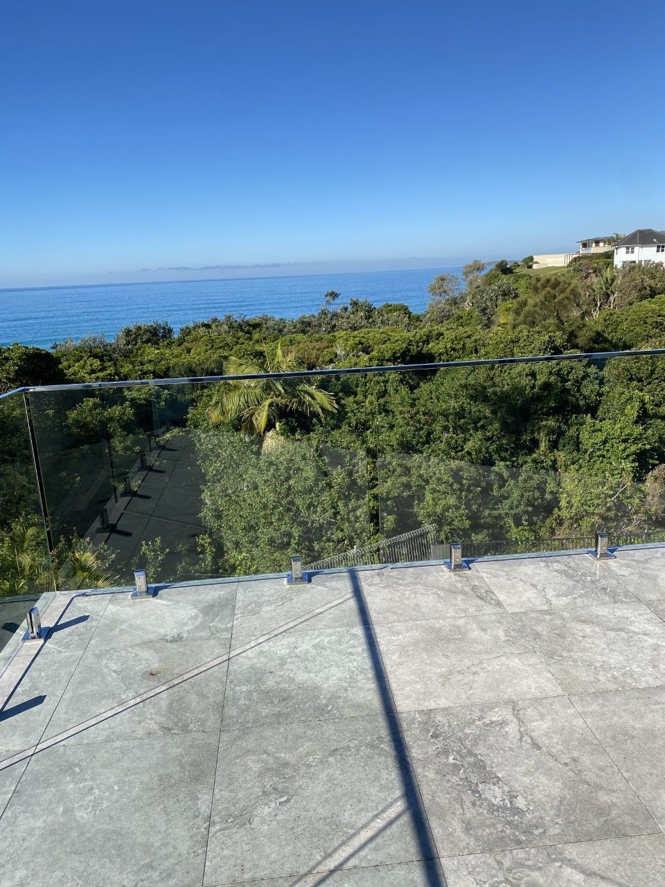 A balcony with a view of the ocean and trees — Fabricator In Coffs Harbour, NSW