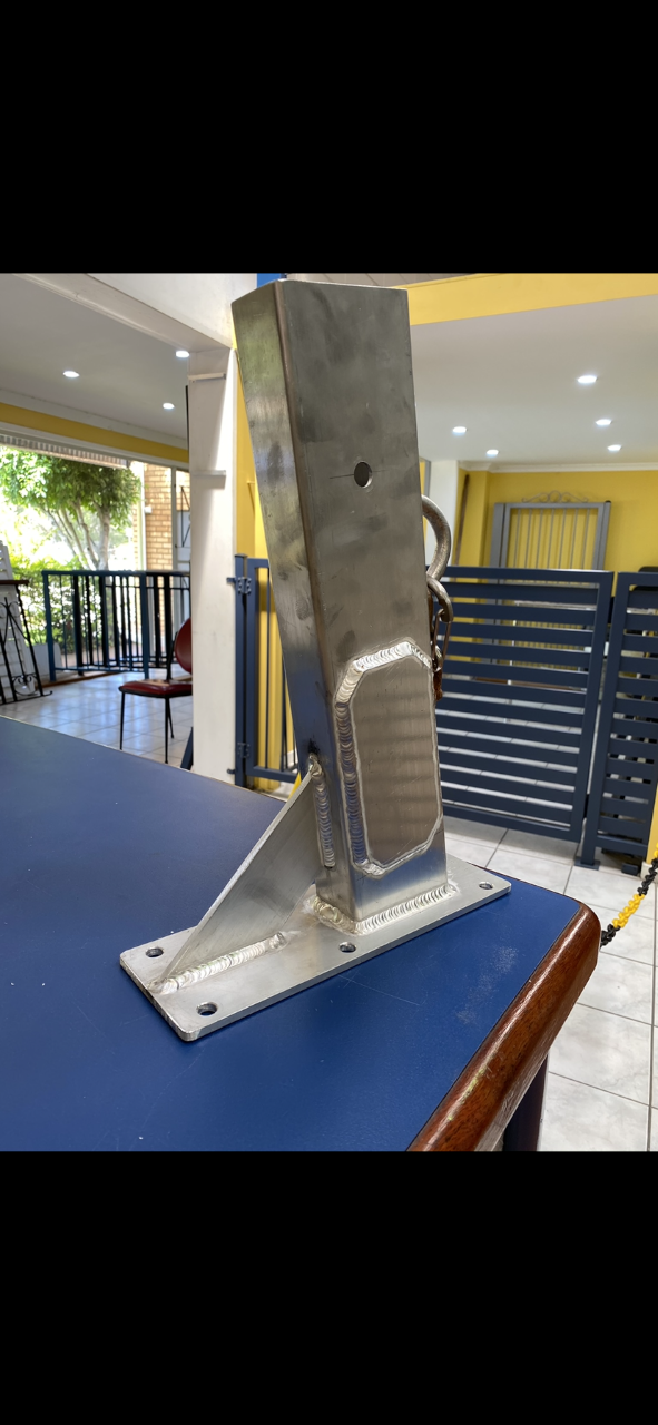 A metal object is sitting on top of a blue table — Fabricator In Coffs Harbour, NSW