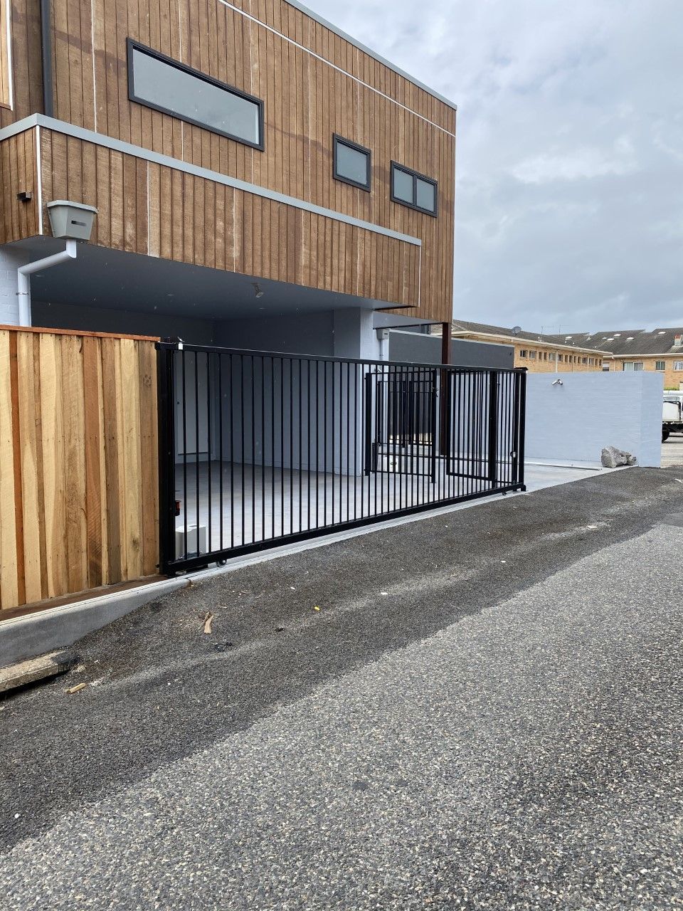 A large wooden building with a sliding gate in front of it — Fabricator In Coffs Harbour, NSW