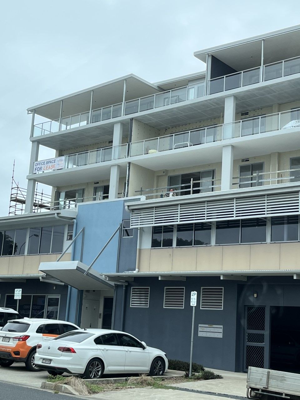 A large building with cars parked in front of it — Fabricator In Coffs Harbour, NSW