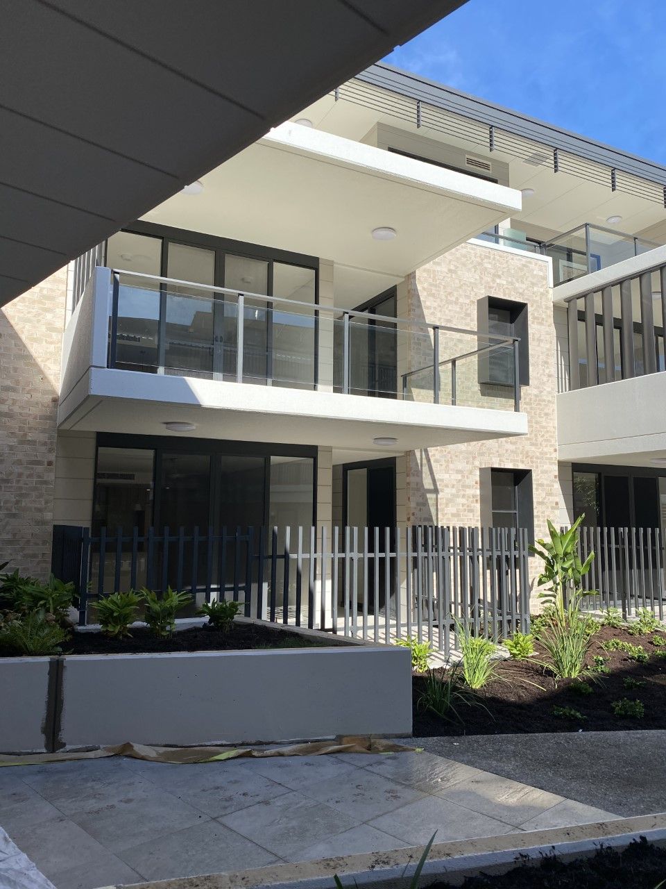A large building with a lot of windows and balconies — Fabricator In Coffs Harbour, NSW