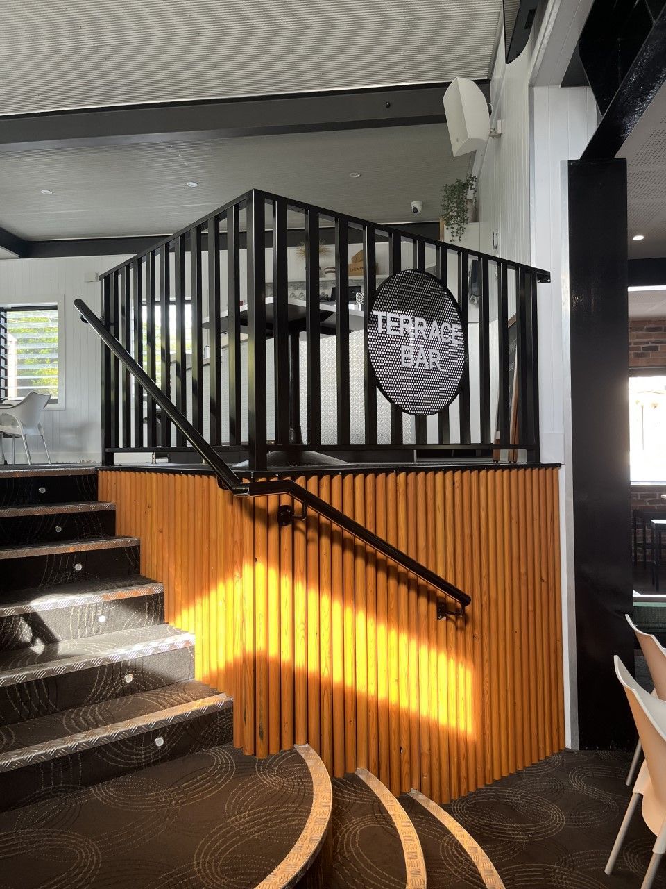 A staircase leading up to a balcony in a restaurant — Fabricator In Coffs Harbour, NSW