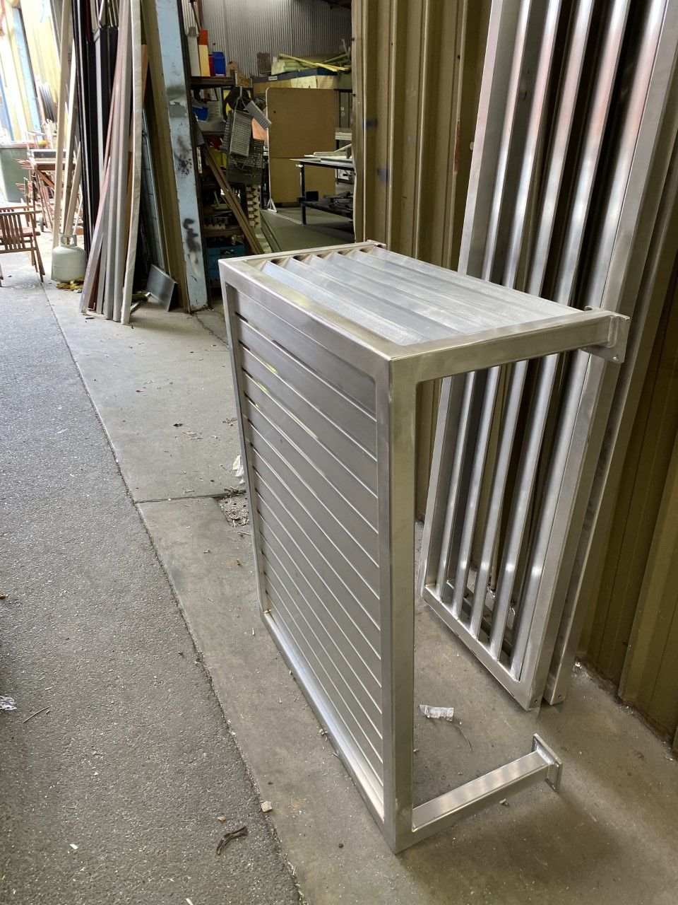 A stainless steel table is sitting on the ground in a room — Fabricator In Coffs Harbour, NSW