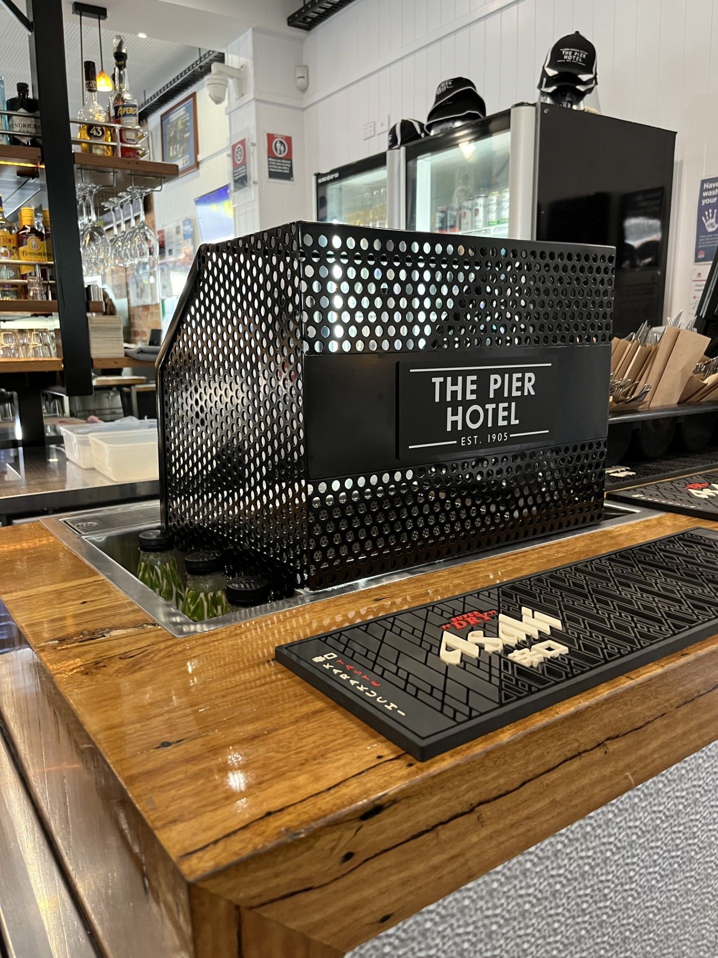 A wooden bar with a sign that says the pier hotel on it — Fabricator In Coffs Harbour, NSW