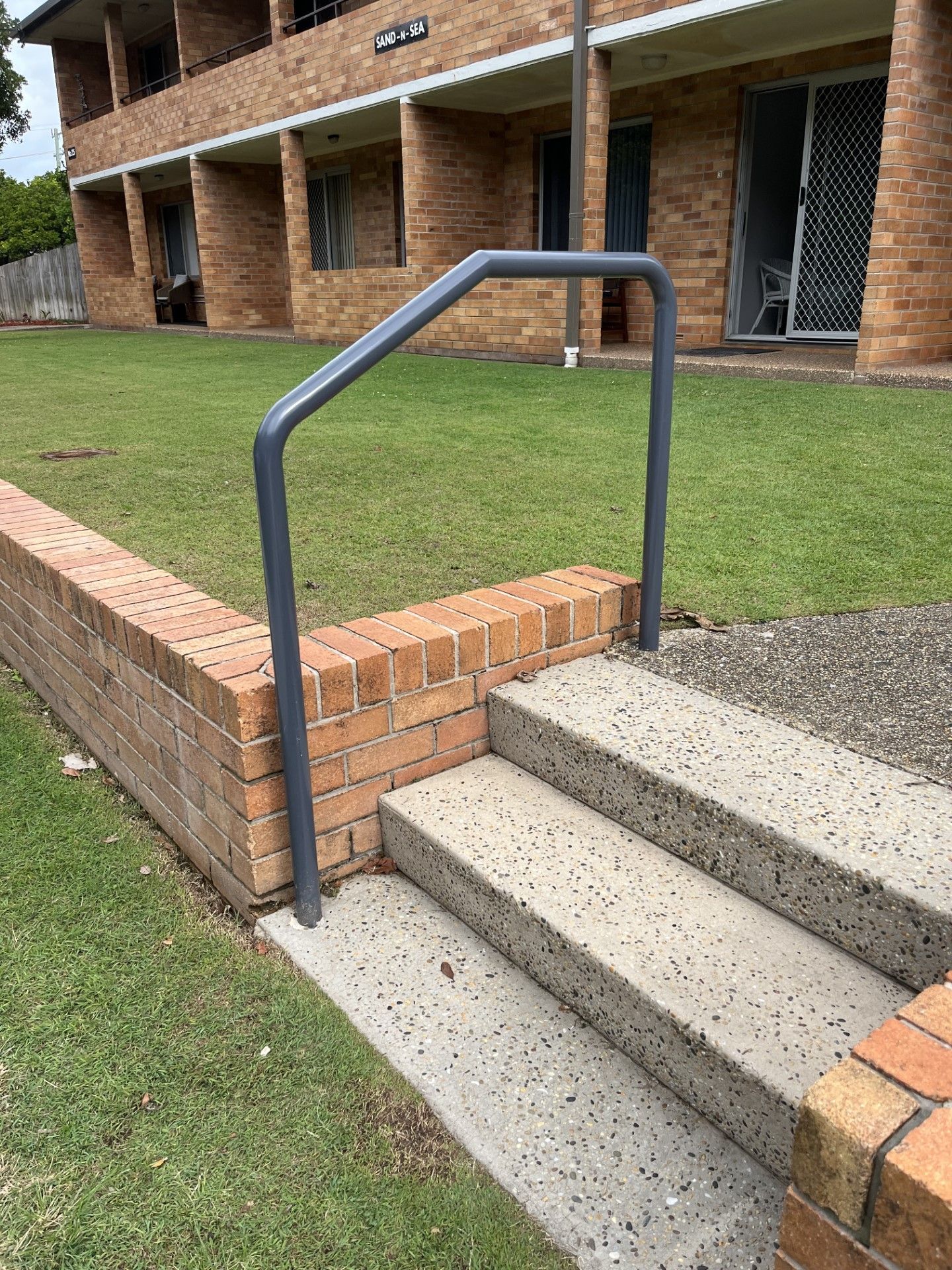 A set of stairs leading up to a building with a hand rail — Fabricator In Coffs Harbour, NSW