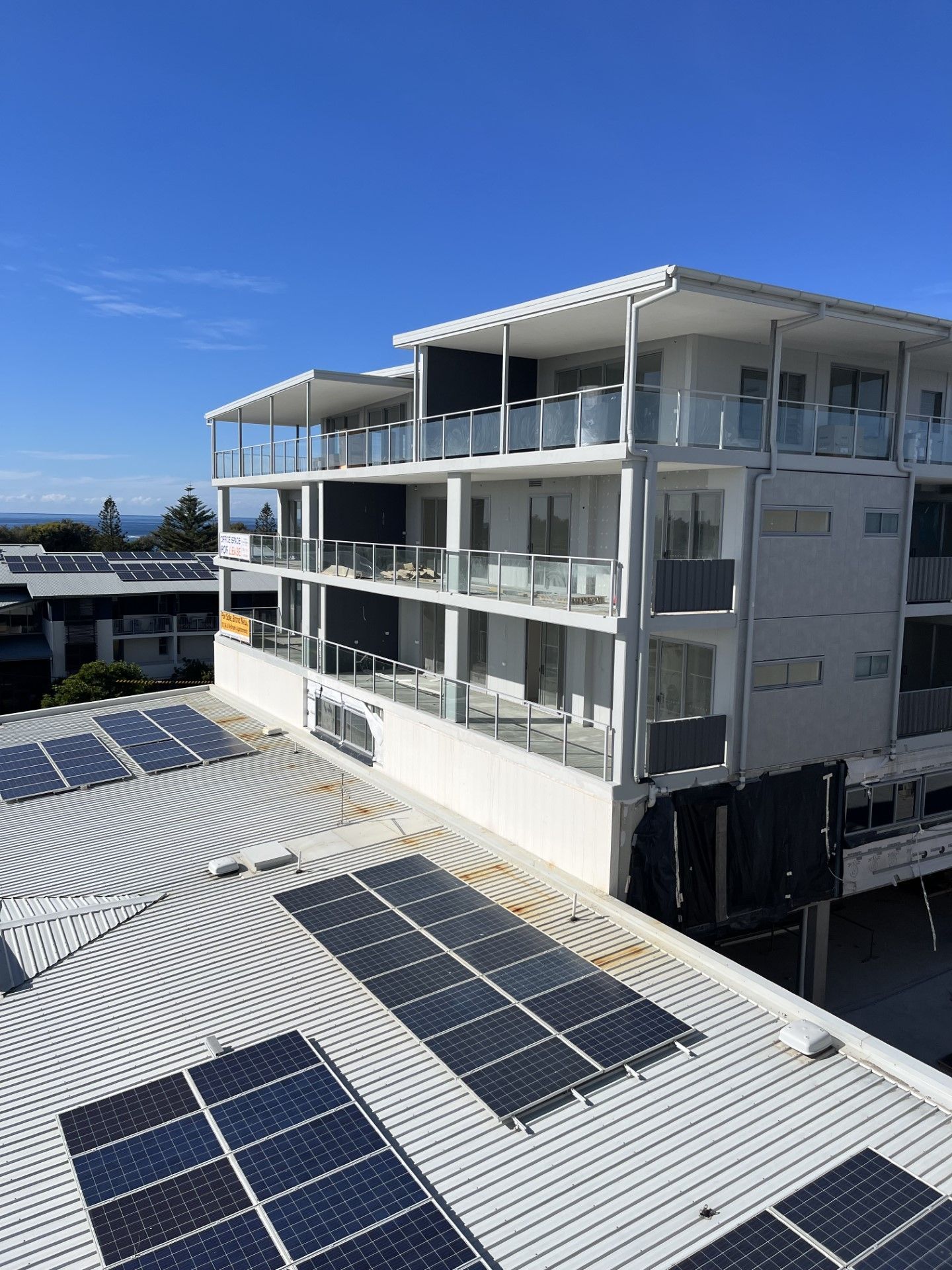 A large building with a lot of solar panels on the roof — Fabricator In Coffs Harbour, NSW