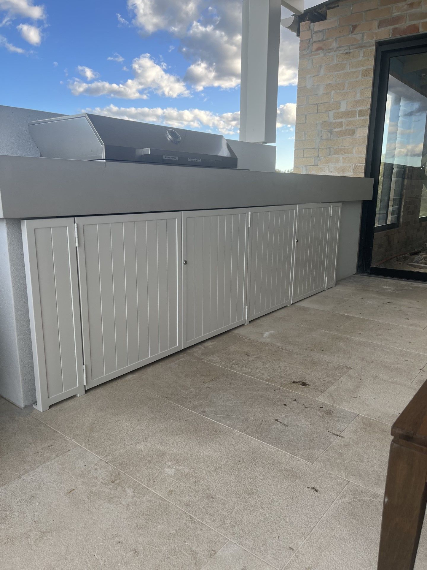 A white cabinet with a grill on top of it on a patio — Fabricator In Coffs Harbour, NSW