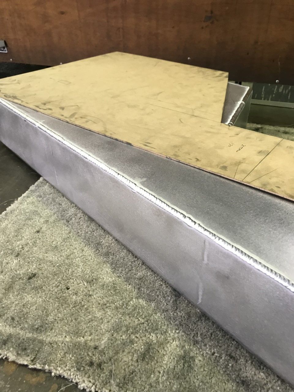 A piece of metal is sitting on top of a carpet — Fabricator In Coffs Harbour, NSW