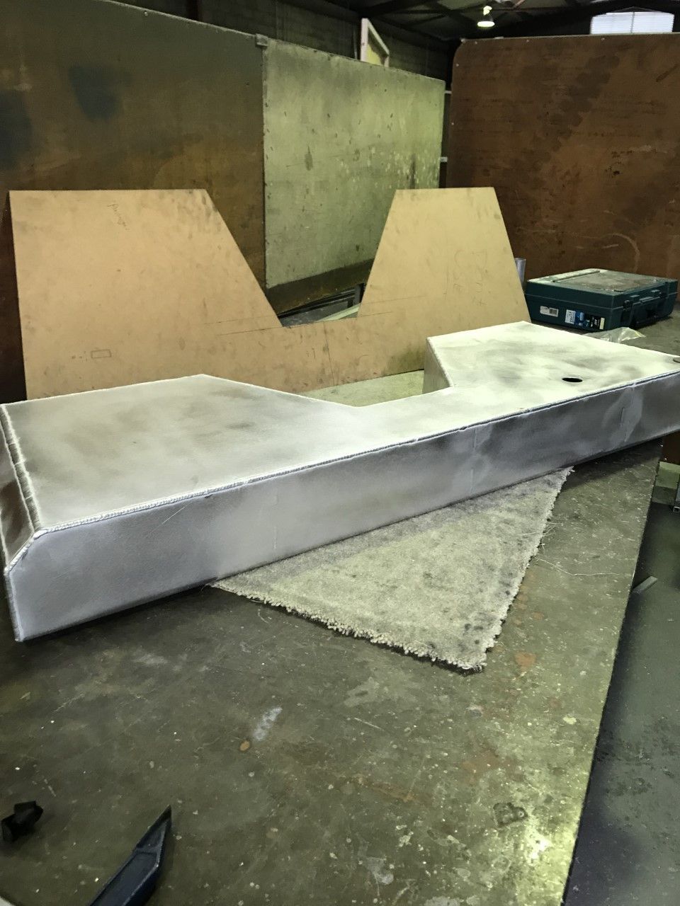 A large piece of metal is sitting on top of a table — Fabricator In Coffs Harbour, NSW