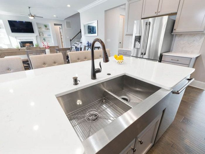 A kitchen with a stainless steel sink