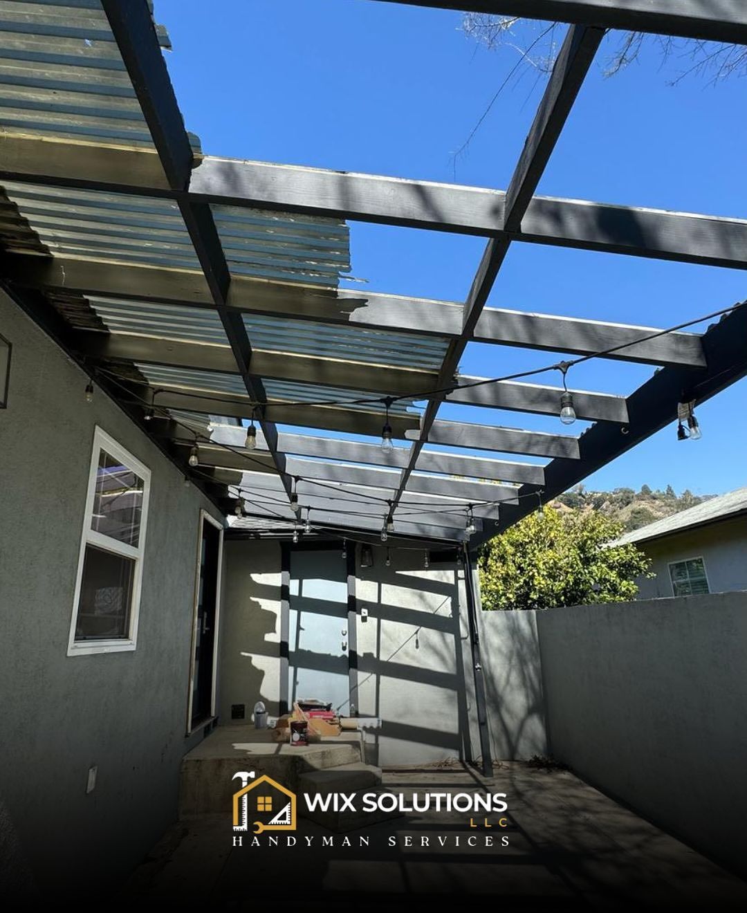 A patio with a pergola and a sign that says wix solutions handyman services