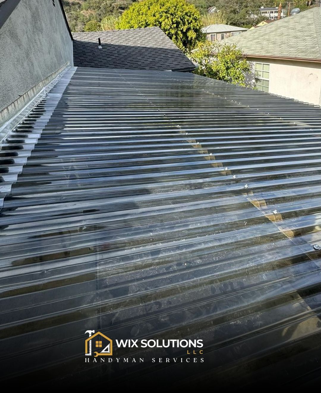 A picture of a roof with a logo for wix solutions on it.