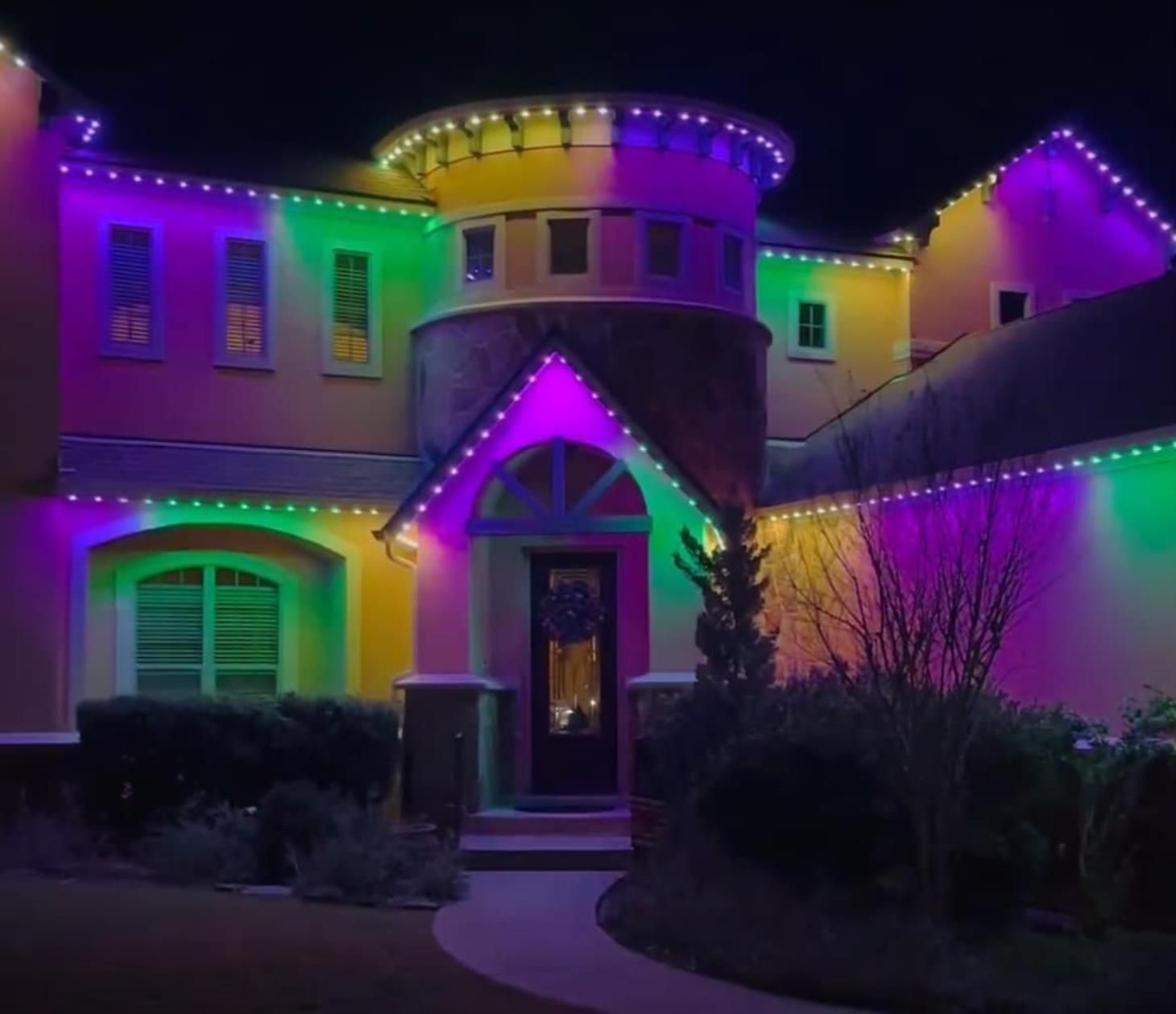 Electrician working on electrical panel, using pliers. Tools and wires visible.