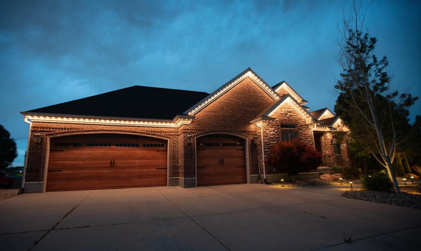 Electrician using a multimeter on an electrical panel.