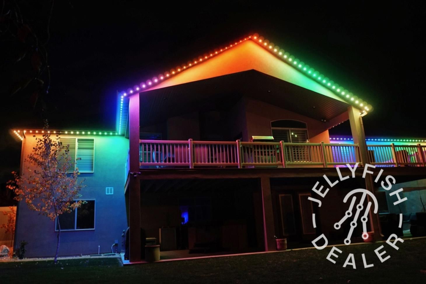 Person wiring an electrical outlet into a blue box in a wall during construction.