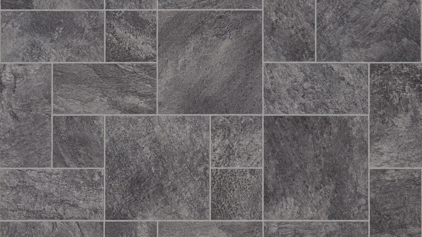 A close up of a gray tile floor.