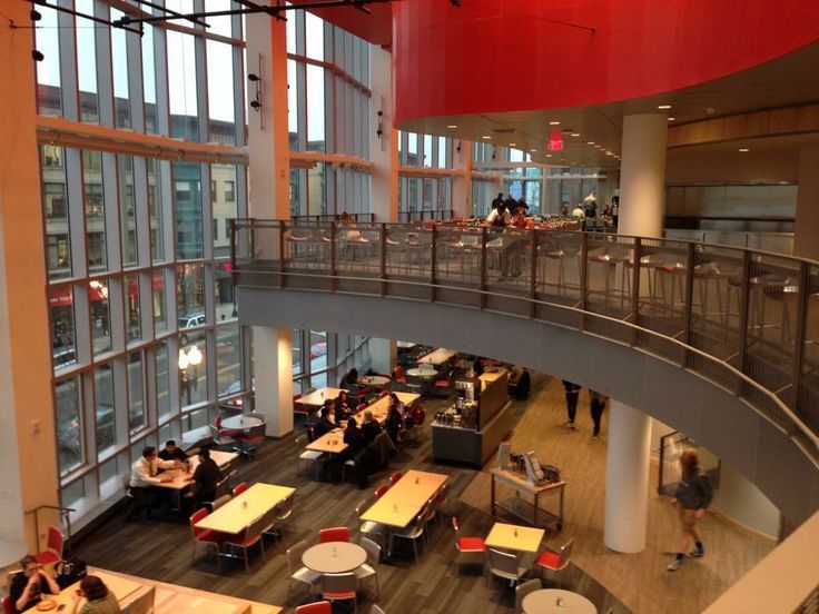 The inside of a building with tables and chairs