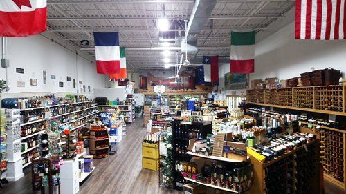The inside of a store with flags hanging from the ceiling