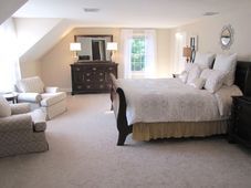 There is a large bed in the middle of the room.