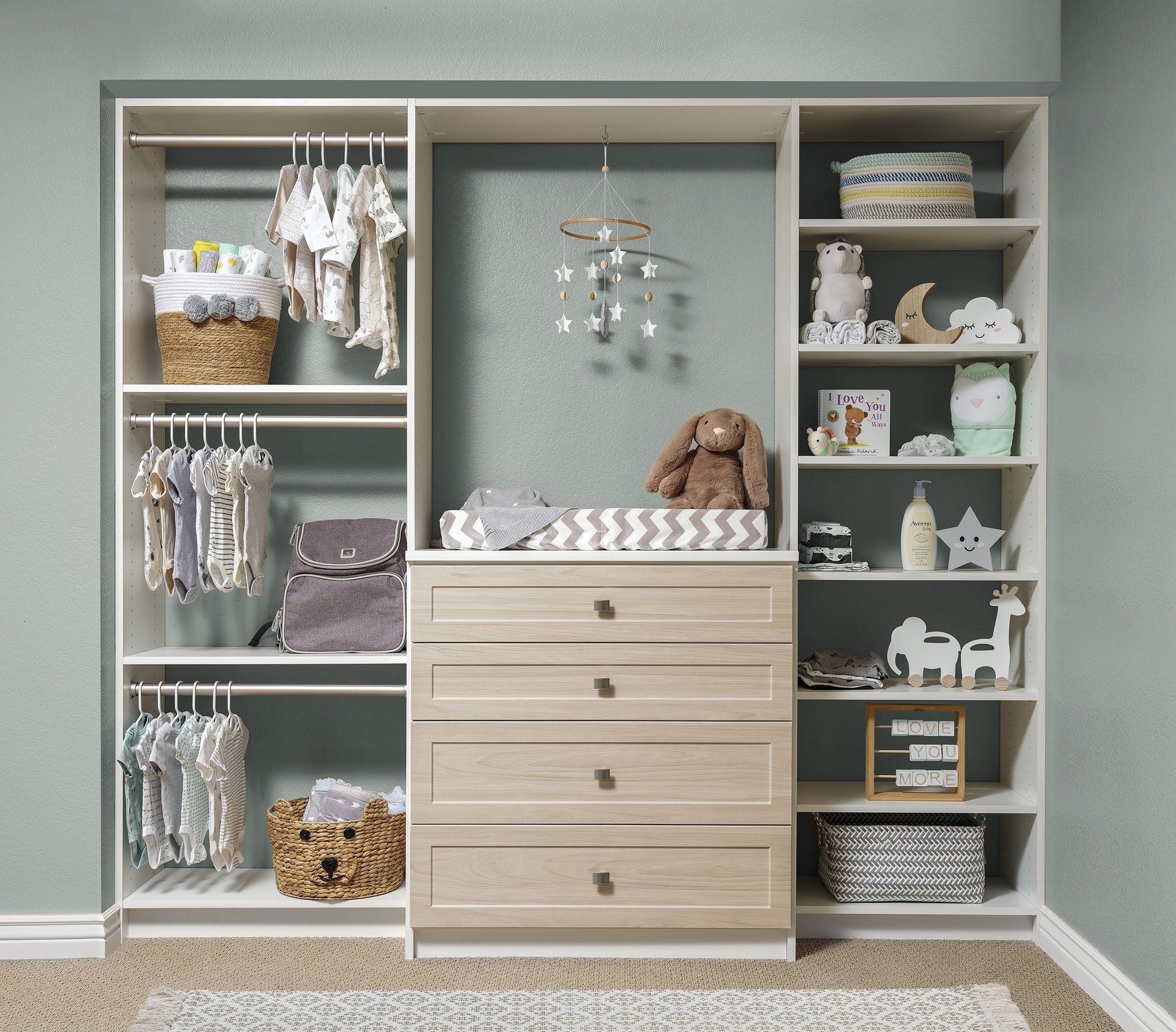 There is a changing table in the middle of the closet.