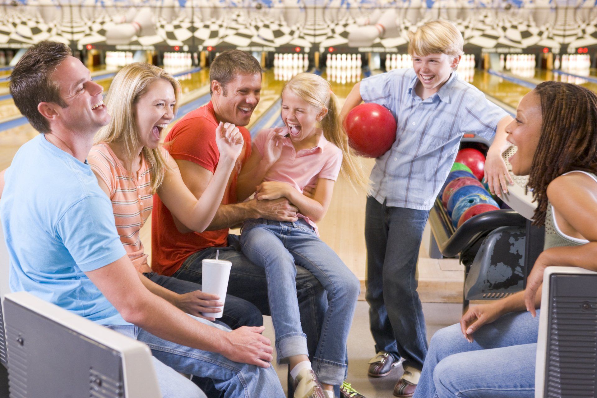 Happy Family Playing Bowling — Fitchburg, WI — Ten Pin Alley
