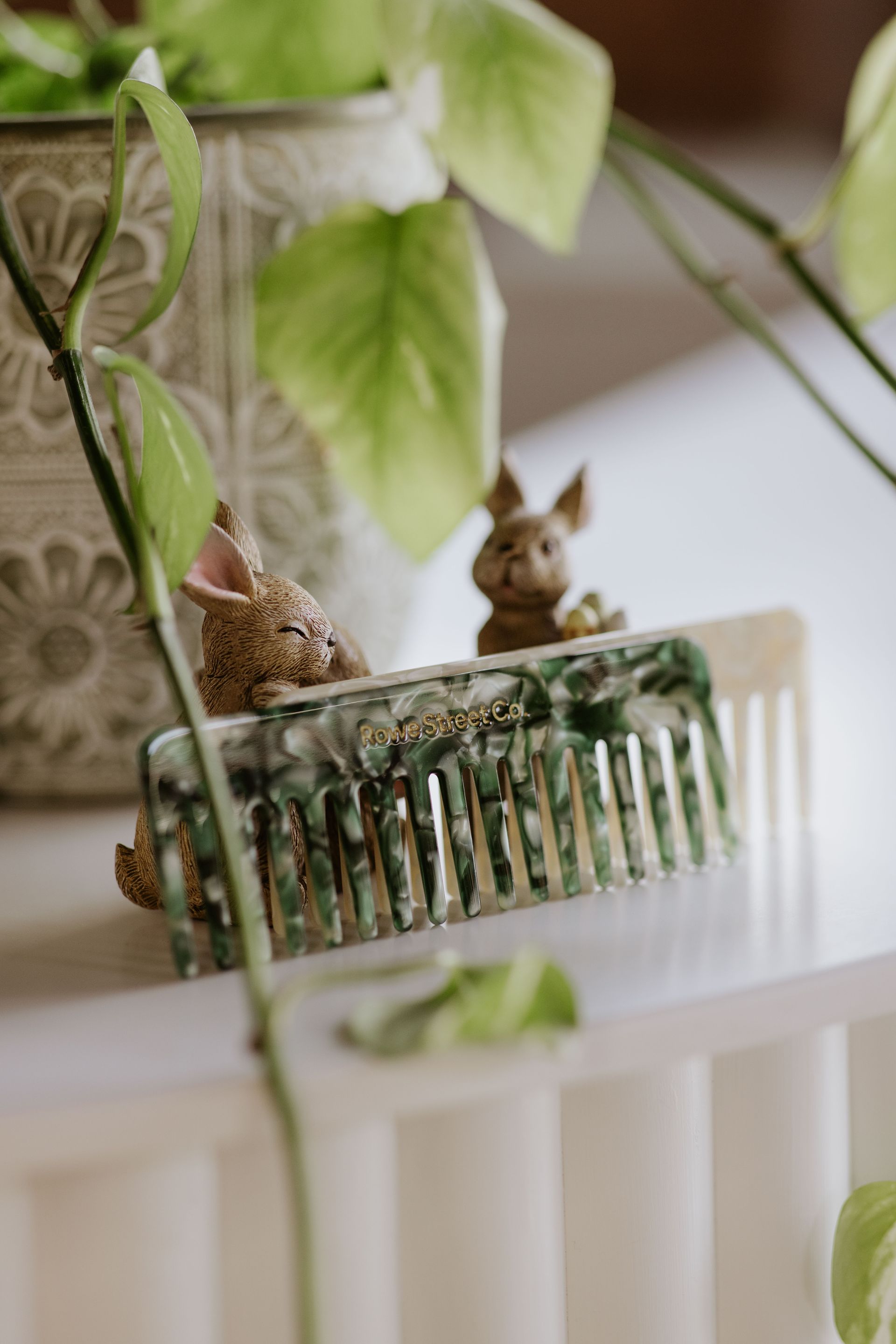 Two combs are sitting on top of each other on a white surface. — Rowe Street Collective In Shepparton, VIC