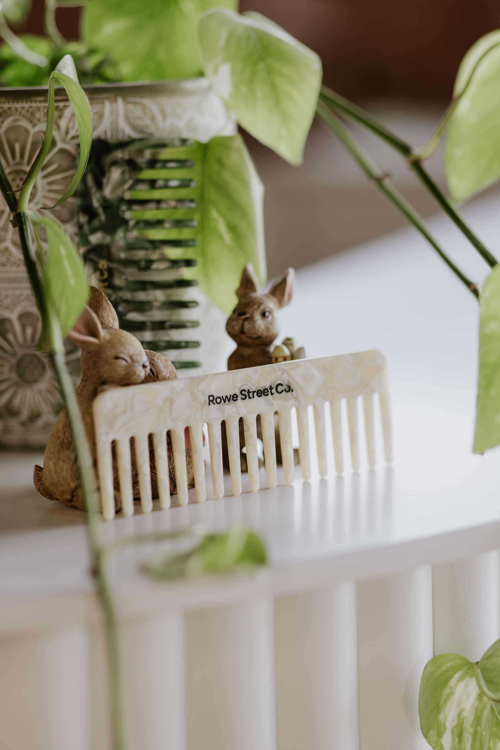 A brush is sitting on top of a white tray on a table. — Rowe Street Collective In Shepparton, VIC